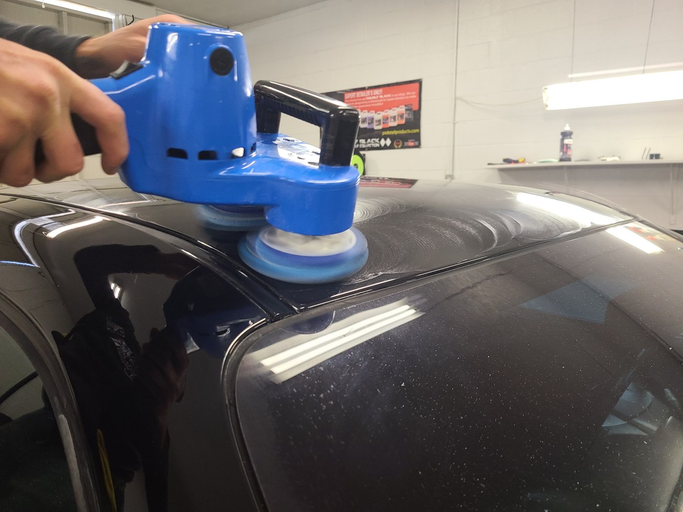 Polishing a vehicle’s paint, from Garcia’s public business gallery